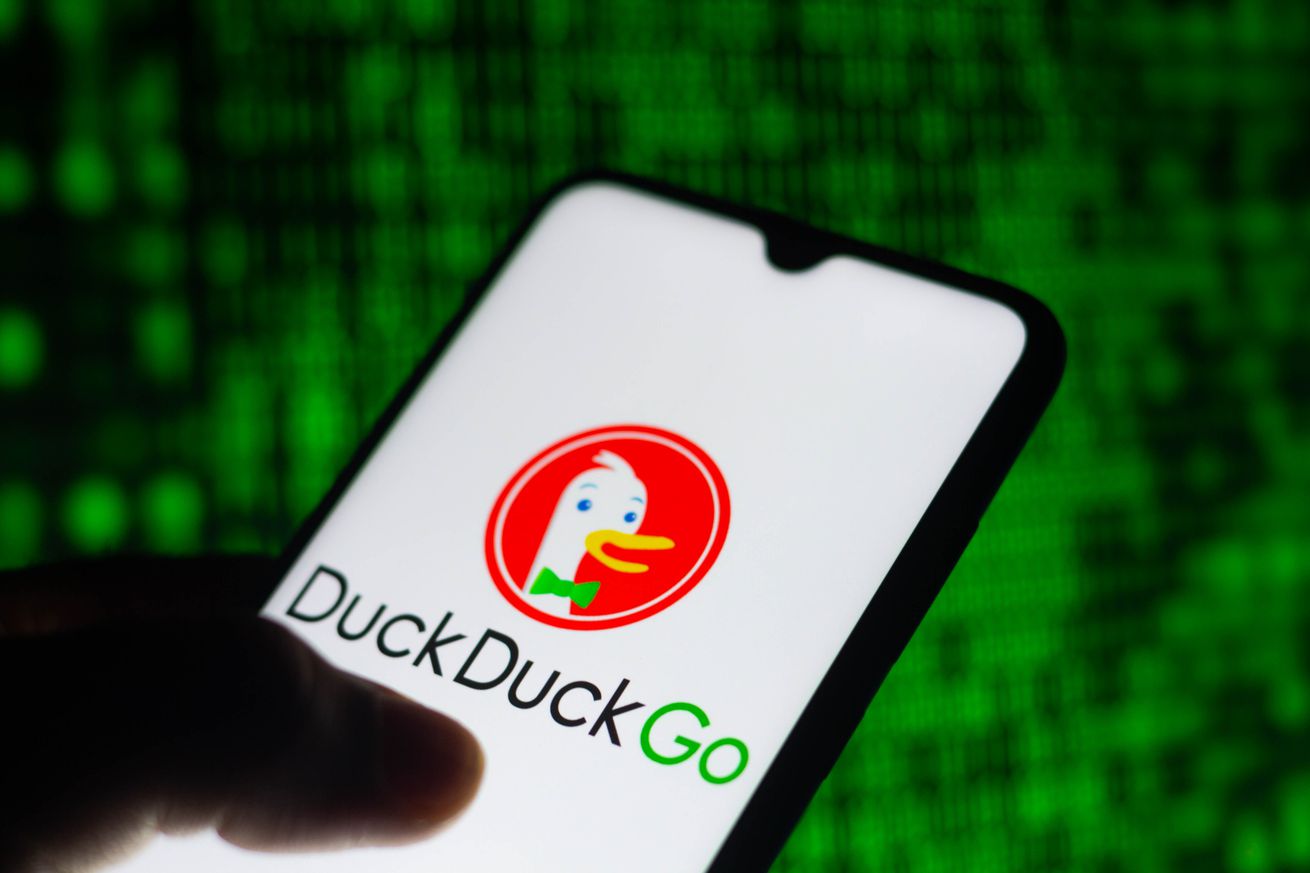 In this photo illustration, the DuckDuckGo logo seen...